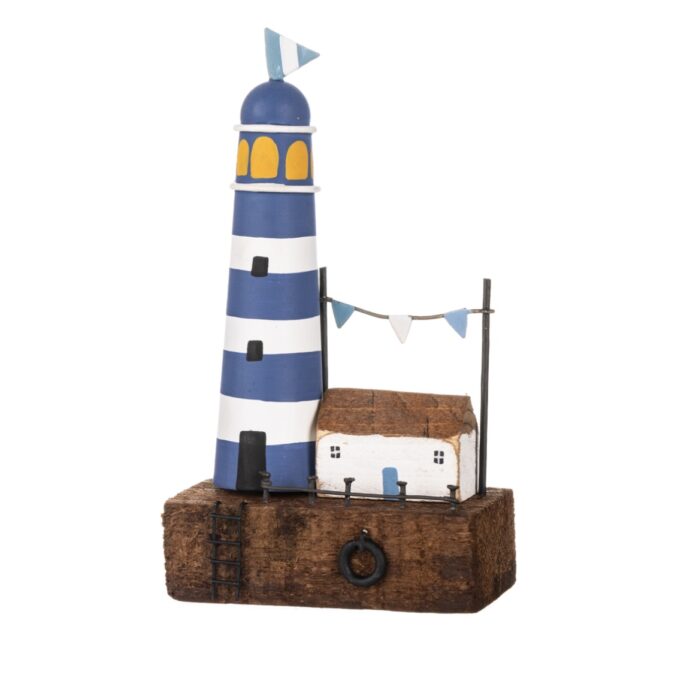 Lighthouse & cottage on block.
